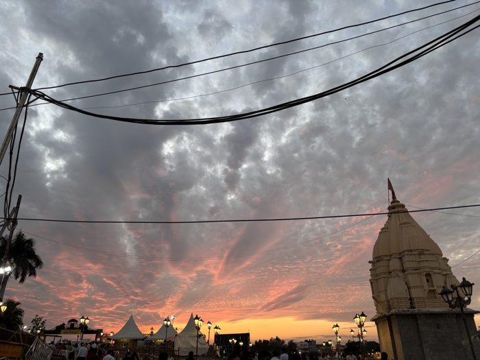 Temple silhouette against pink clouds