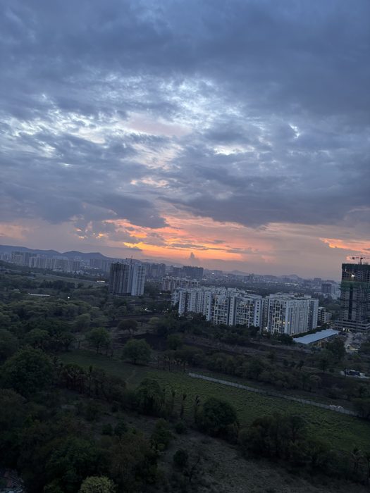 Monsoon clouds over a green city